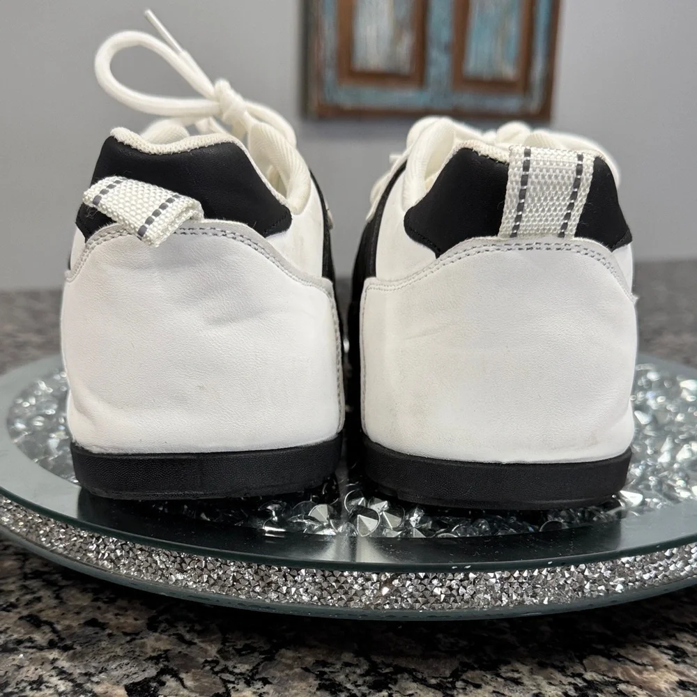 White and Black womens fashion Sneakers with gold accents EUC 10